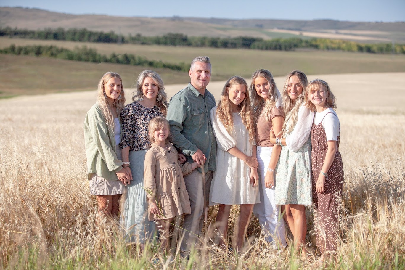 Showhome Furniture family together in a wheat field