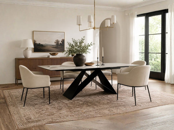 White extending dining table paired with upholstered chairs in a Victoria dining room